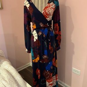 Eloqui vibrant print maxi dress with slit and tie belt.